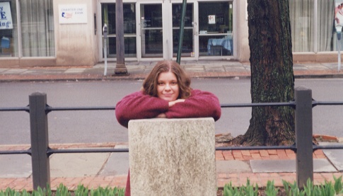 Christine posing with a headstone.