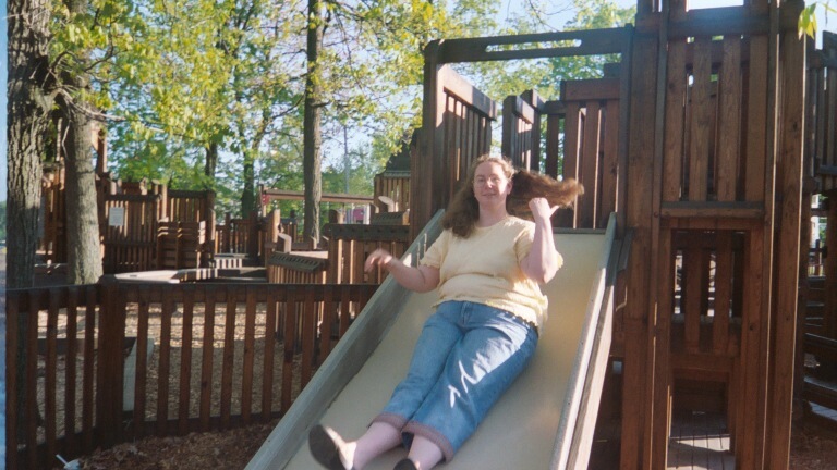 Cindy Goes Down the Slide. The kids' playground is huge.