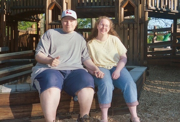 Frank and Cindy sitting at the Playground