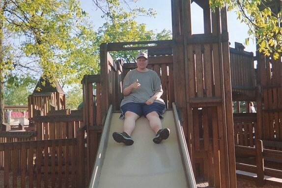 Frank went down the slide too. Yes, he's fat, but his waist isn't that huge. He has Cindy's pocketbook in his left pocket.