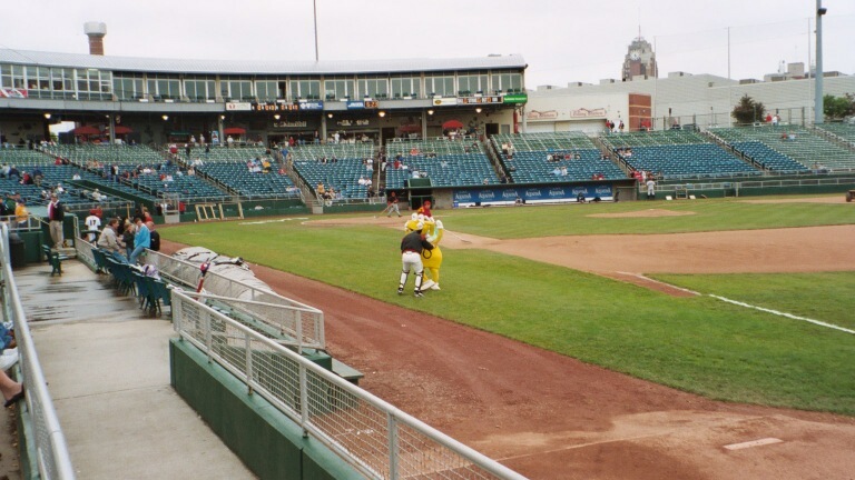 My memory is fuzzy, but I think this is Jake Fox wrestling with the Board of Water and Light mascot. Seconds earlier, he tackled the costumed SOB.