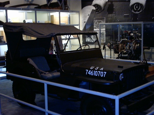 Third Floor war exhibits: B-1 Bomber tailgun, various jeeps, uniforms, etc